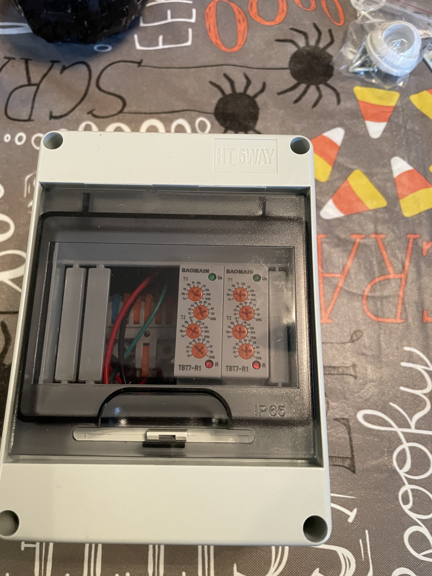 A motor controller, levered connection strip, and two relay modules in a DIN rail box