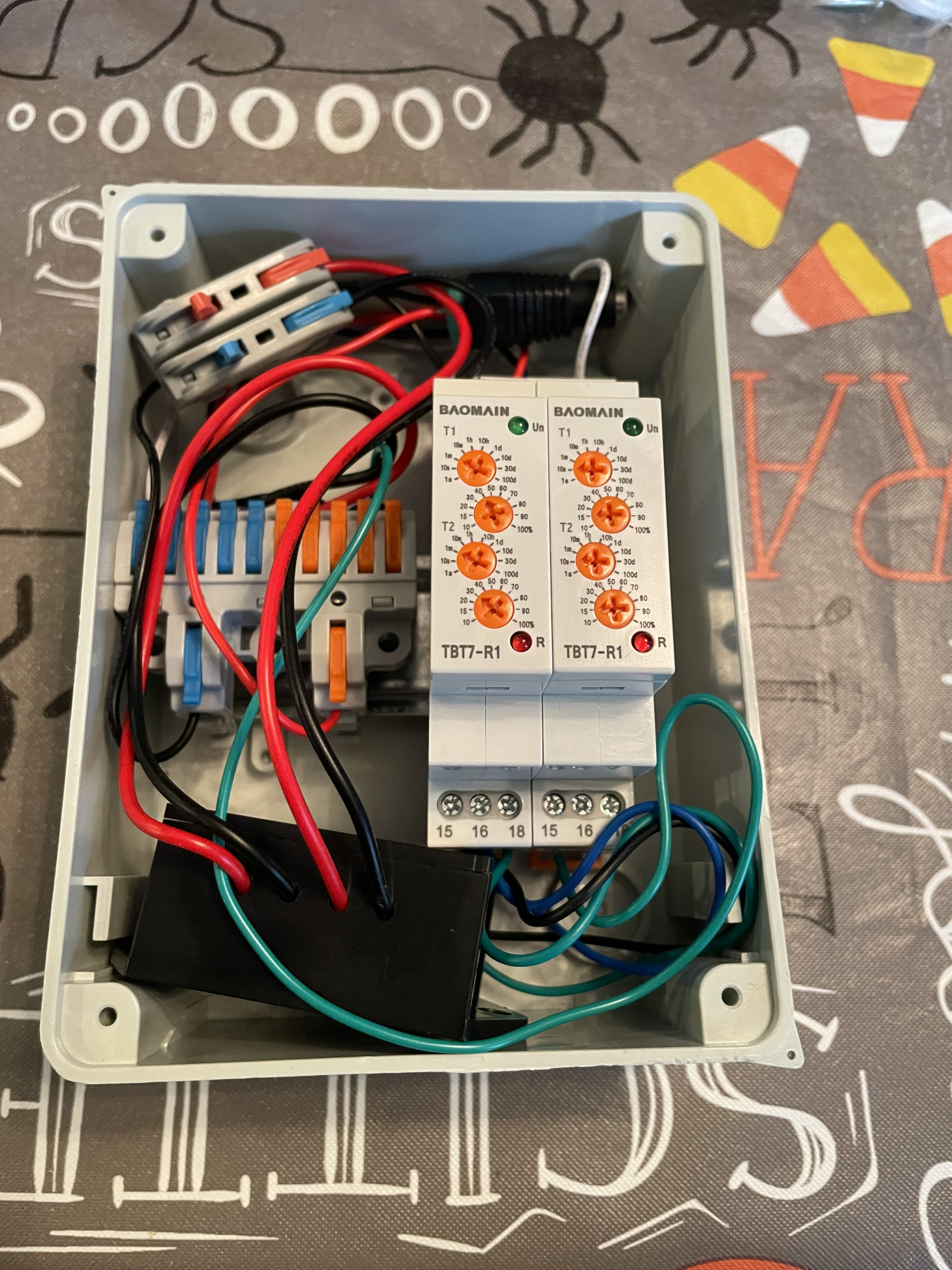A motor controller, levered connection strip, and two relay modules in a DIN rail box