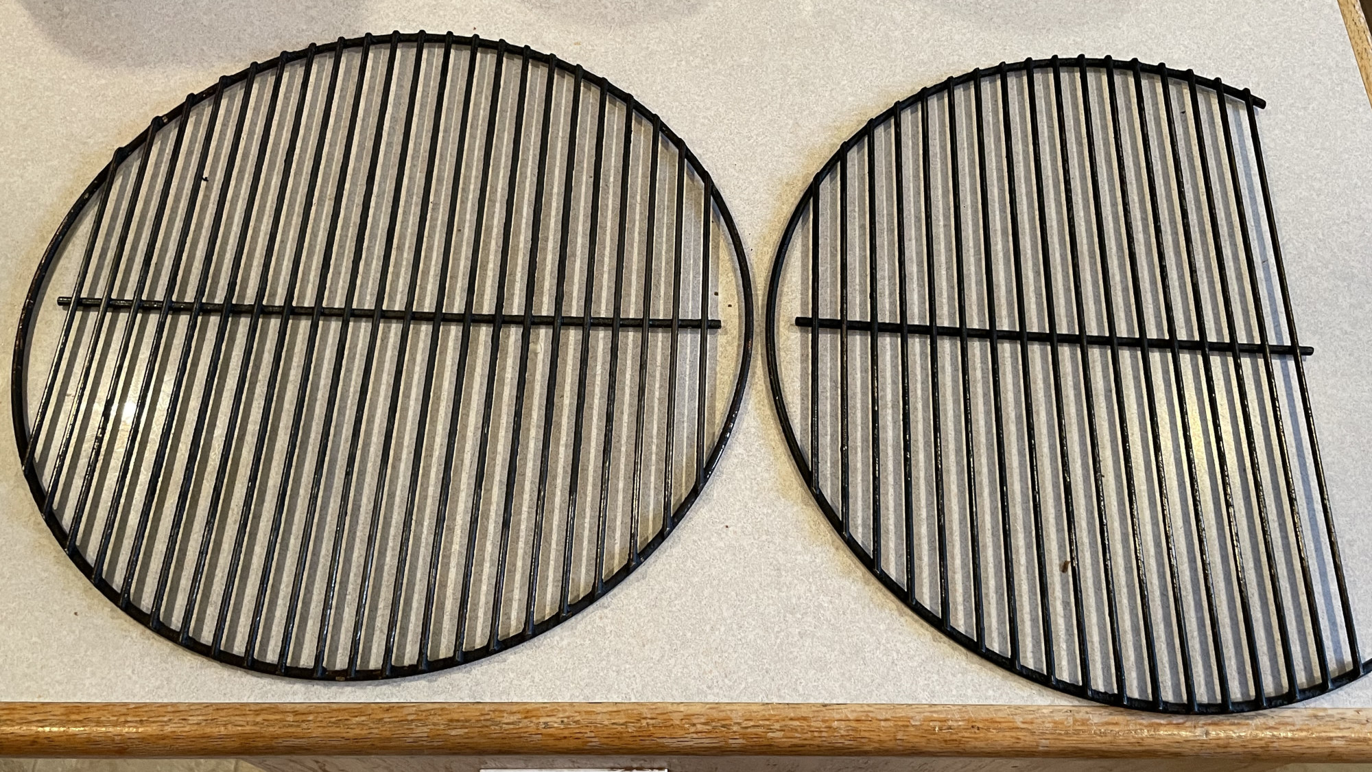 Two Smokey Joe cooking grates, one with 5 wires cut off