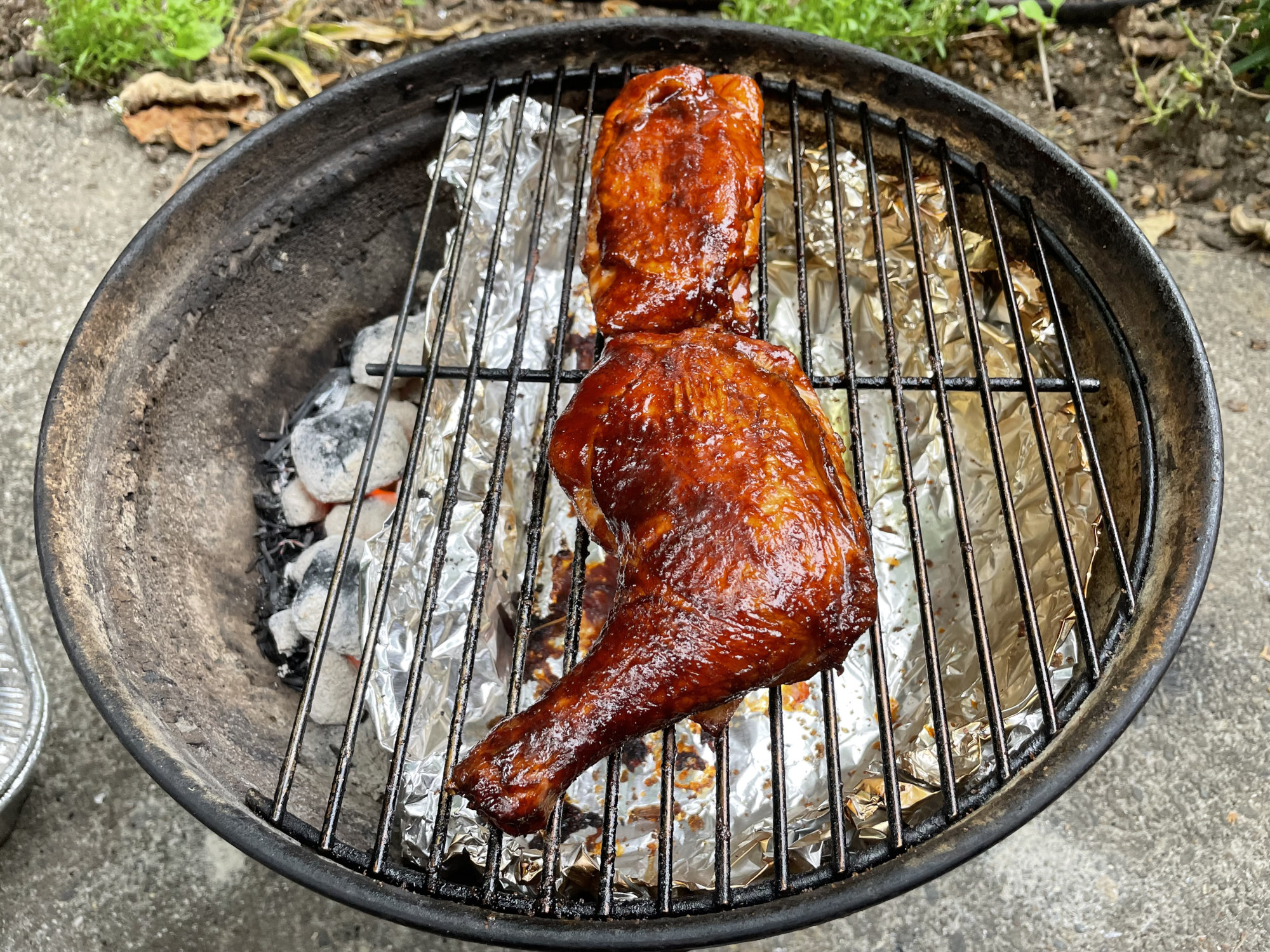 Two Smokey Joe cooking grates, one with 5 wires cut off